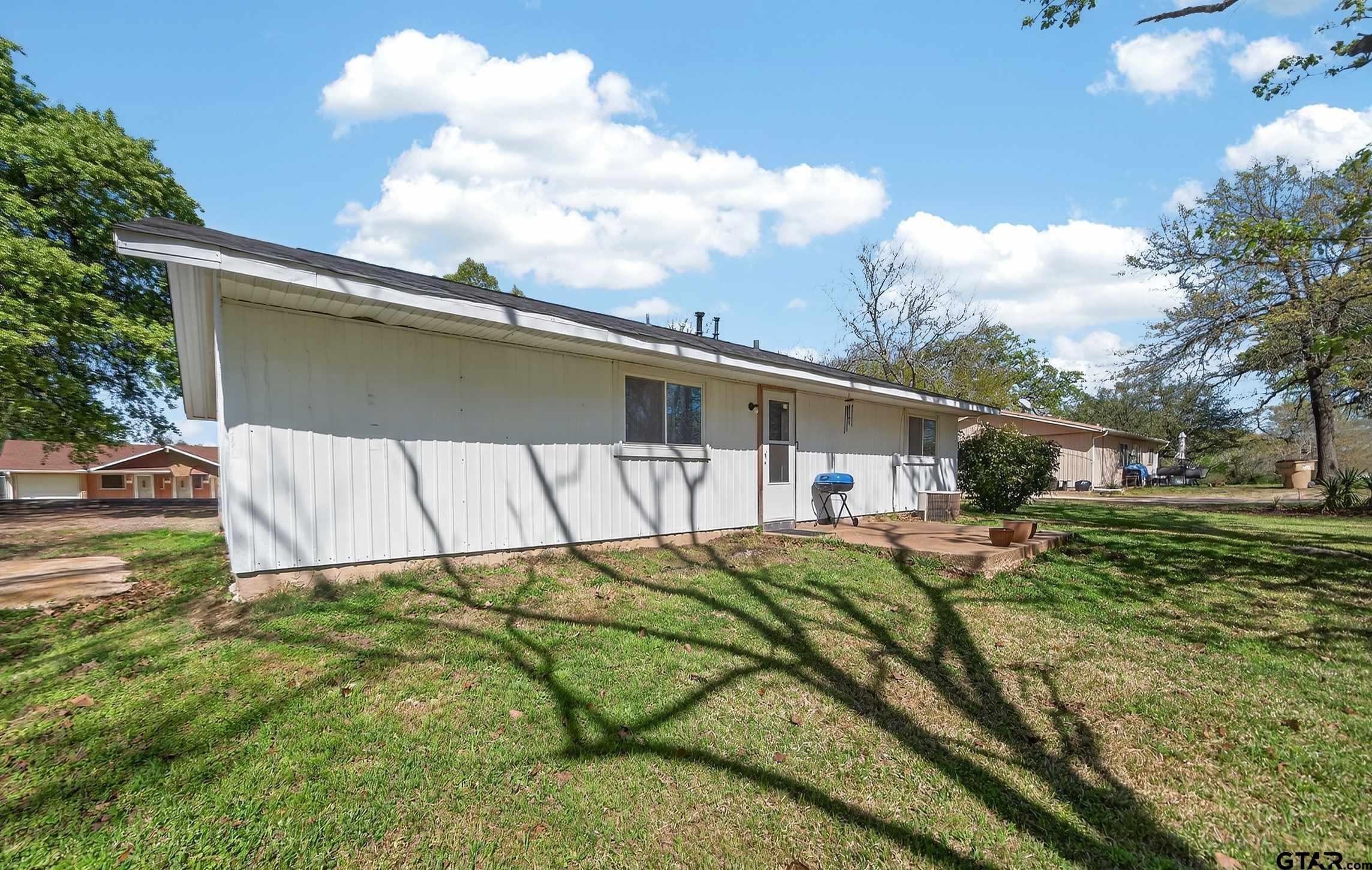 3165 Jackson Avenue Tyler, TX 75705 - Photo 21 of 24 a view of a backyard with a garden and plants