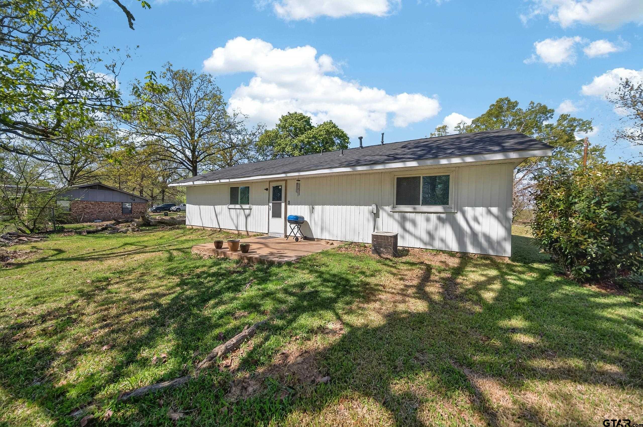 3165 Jackson Avenue Tyler, TX 75705 - Photo 22 of 24 a front view of house with yard and seating area