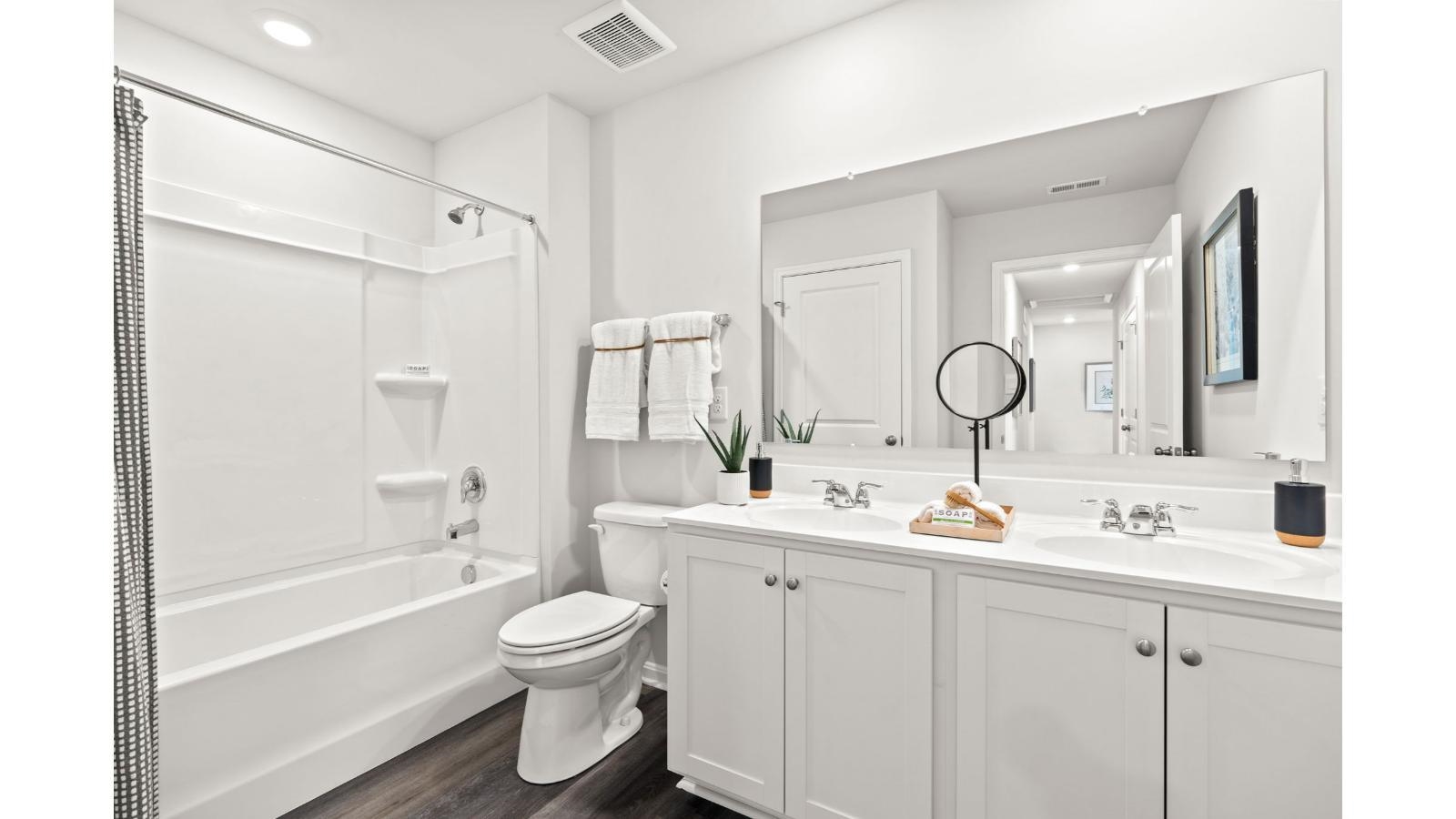 27 George William Lane Lexington, VA 24450 - Photo 21 of 22 a bathroom with a double vanity sink double mirror bathtub and toilet