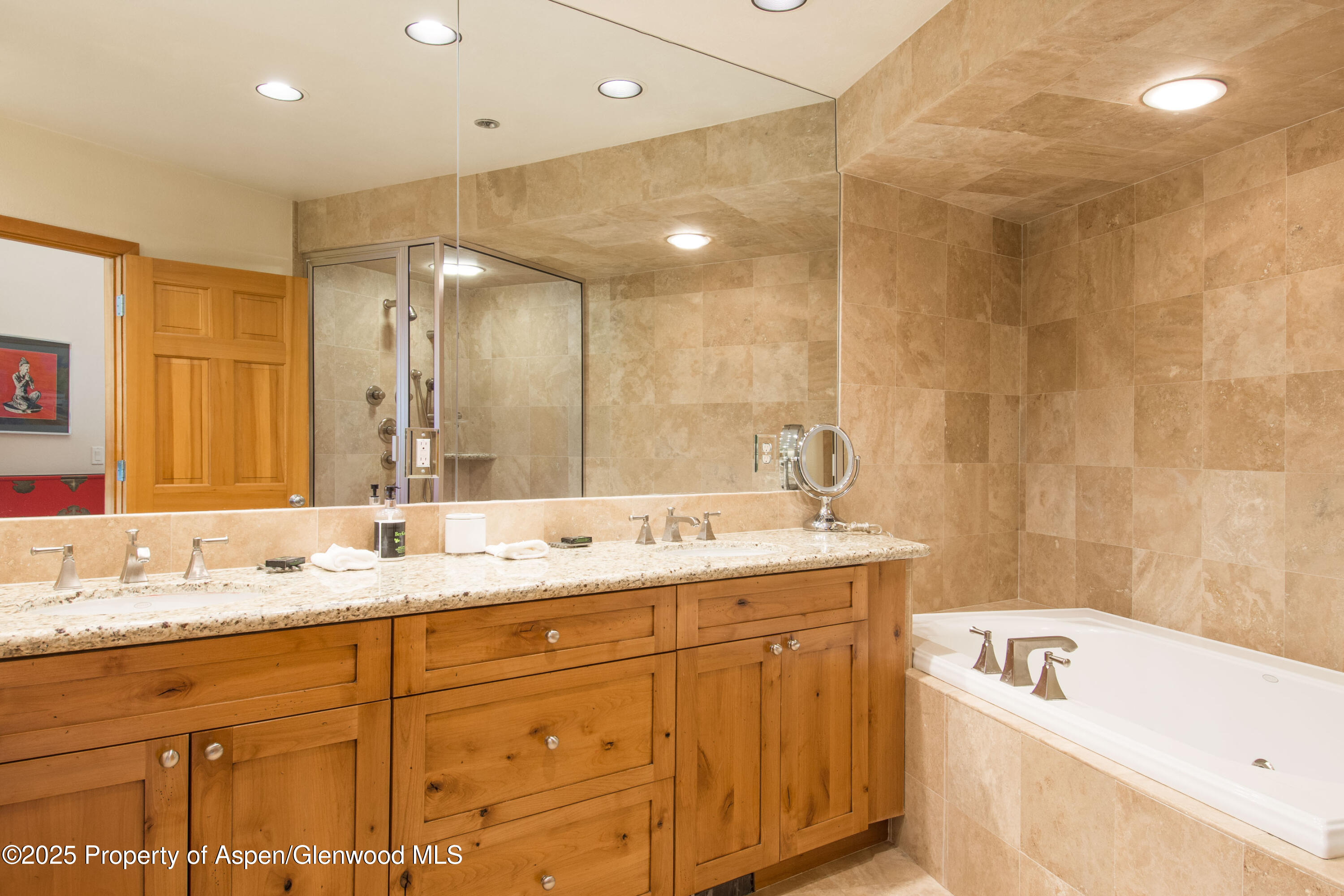 425 Wood Road, Unit 48 Snowmass Village, CO 81615 - Photo 22 of 39 a bathroom with a granite countertop sink mirror and bathtub