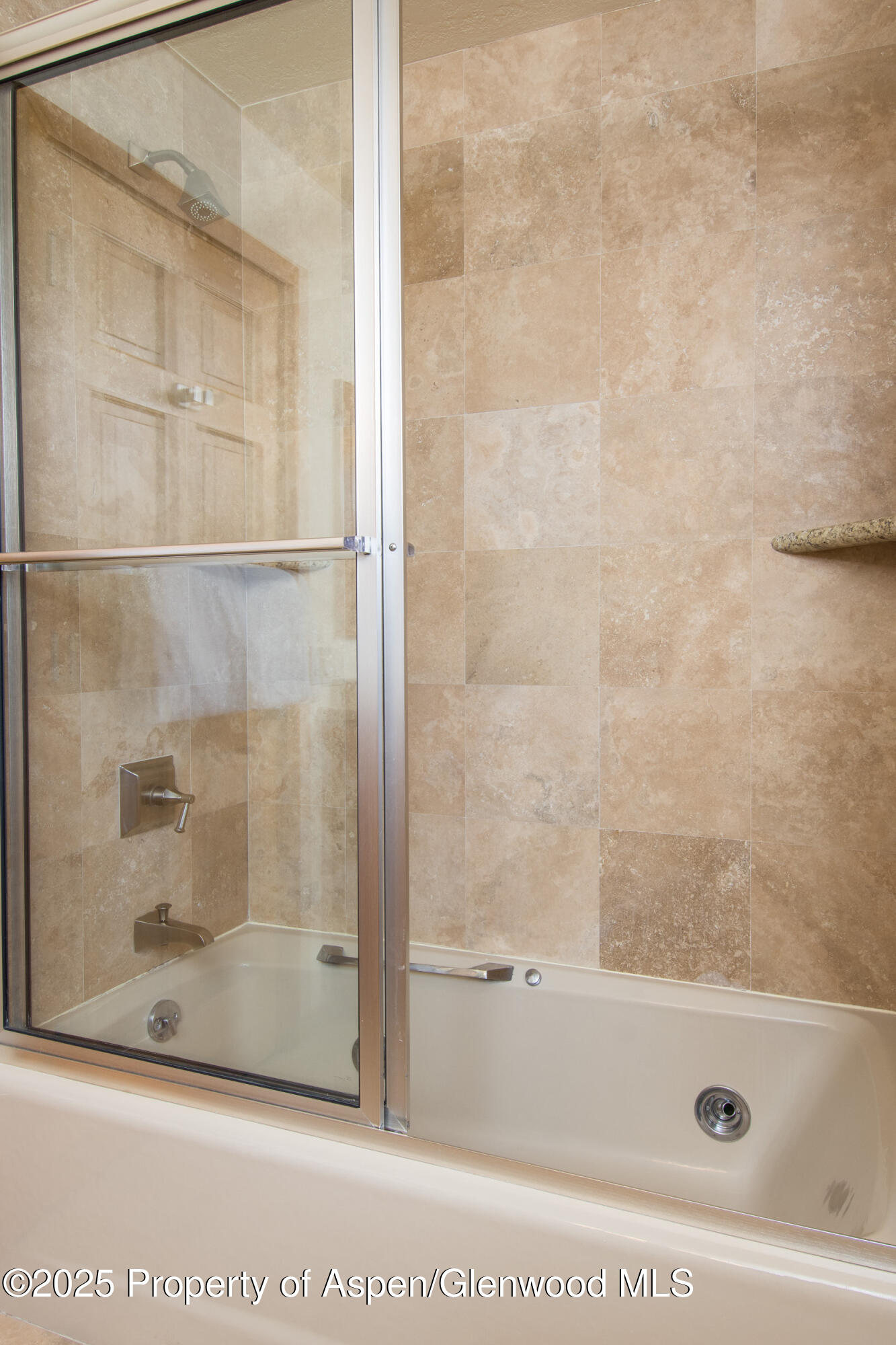 425 Wood Road, Unit 48 Snowmass Village, CO 81615 - Photo 28 of 39 a bathroom with a bathtub and a shower