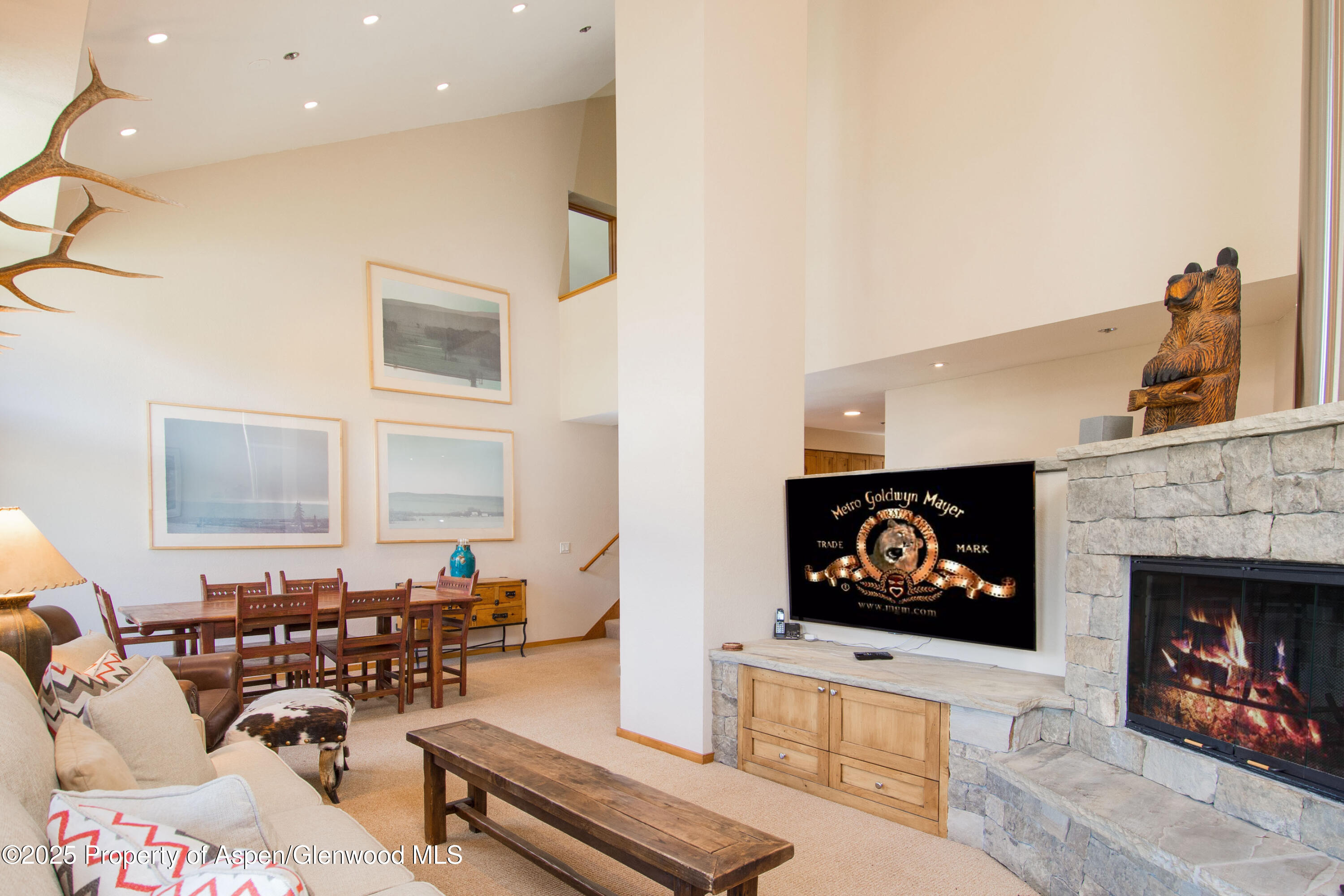 425 Wood Road, Unit 48 Snowmass Village, CO 81615 - Photo 4 of 39 a living room with furniture a fireplace with kitchen view