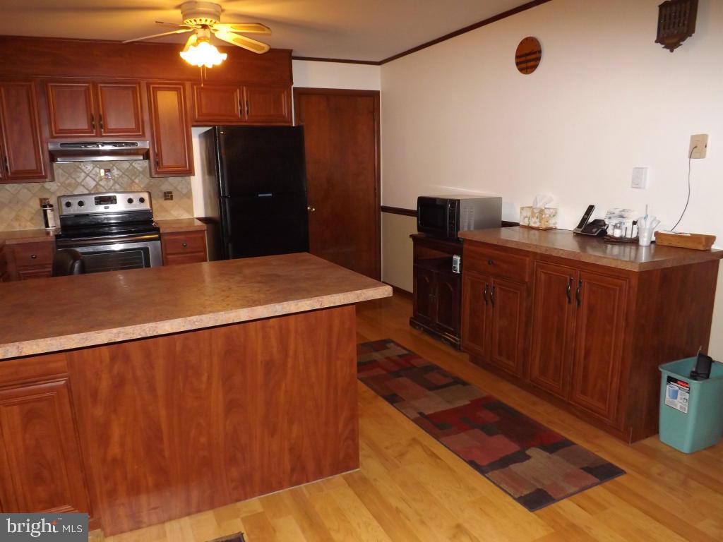 624 Snyder Road Lititz, PA 17543 - Photo 11 of 26 a kitchen with stainless steel appliances a refrigerator and a stove