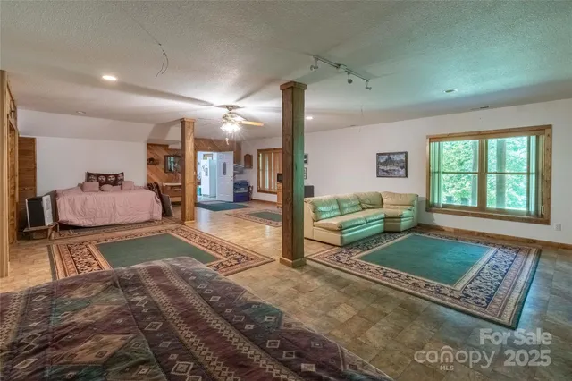 a living room with a couch and a rug
