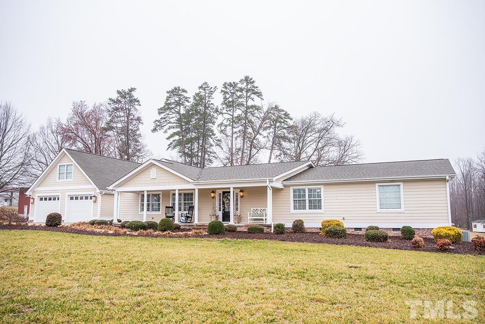 4540 Semora Road Roxboro, NC 27574 - Photo 50 of 58 a front view of a house with a yard