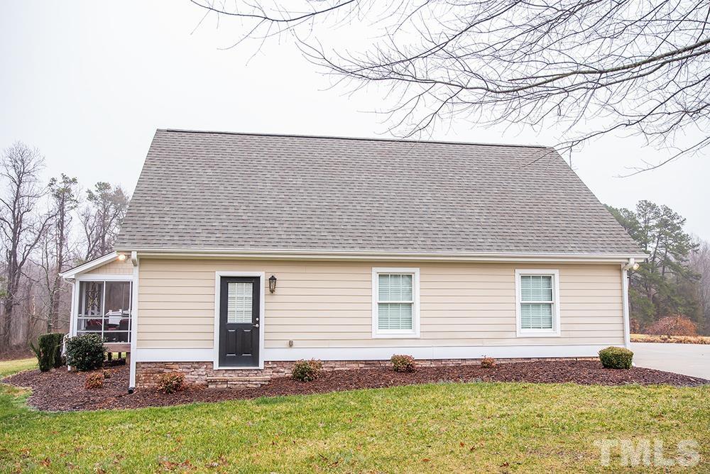 4540 Semora Road Roxboro, NC 27574 - Photo 54 of 58 a backyard of a house with table and chairs