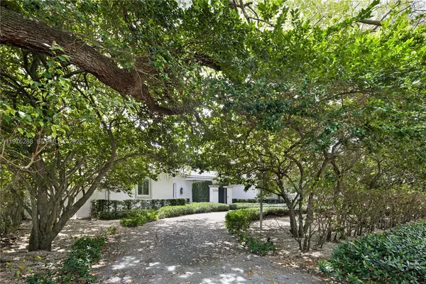 a backyard of a house with lots of green space
