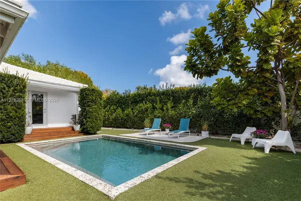 a view of a swimming pool with a patio