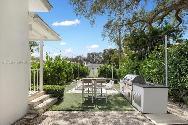 a view of a yard with a patio
