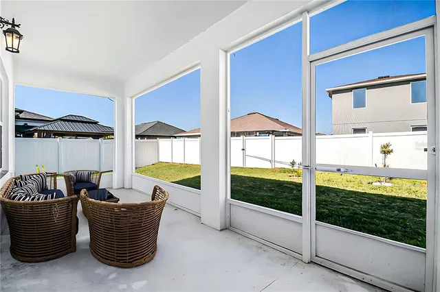 a living room with furniture and a garden