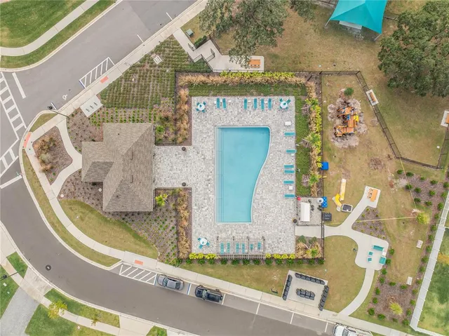 swimming pool view with a garden space