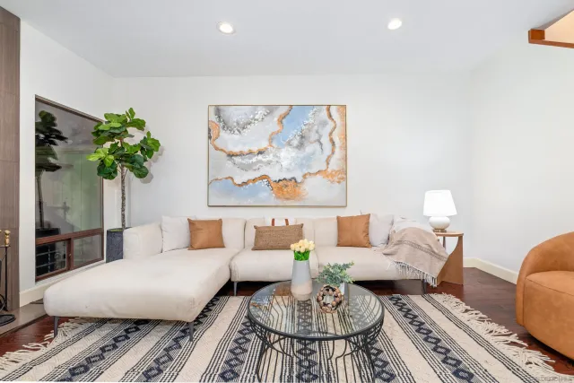 a living room with furniture and a rug