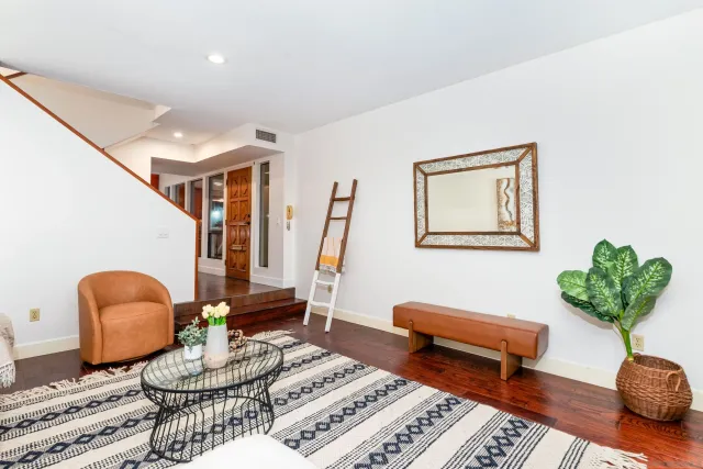 a living room with furniture and a rug