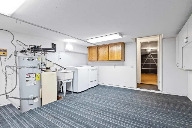 a view of a storage & utility room with two washing machine