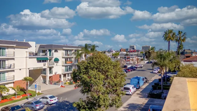 a view of a swimming pool with furniture
