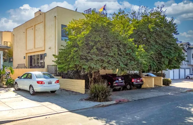 a view of a parked cars in front of a house