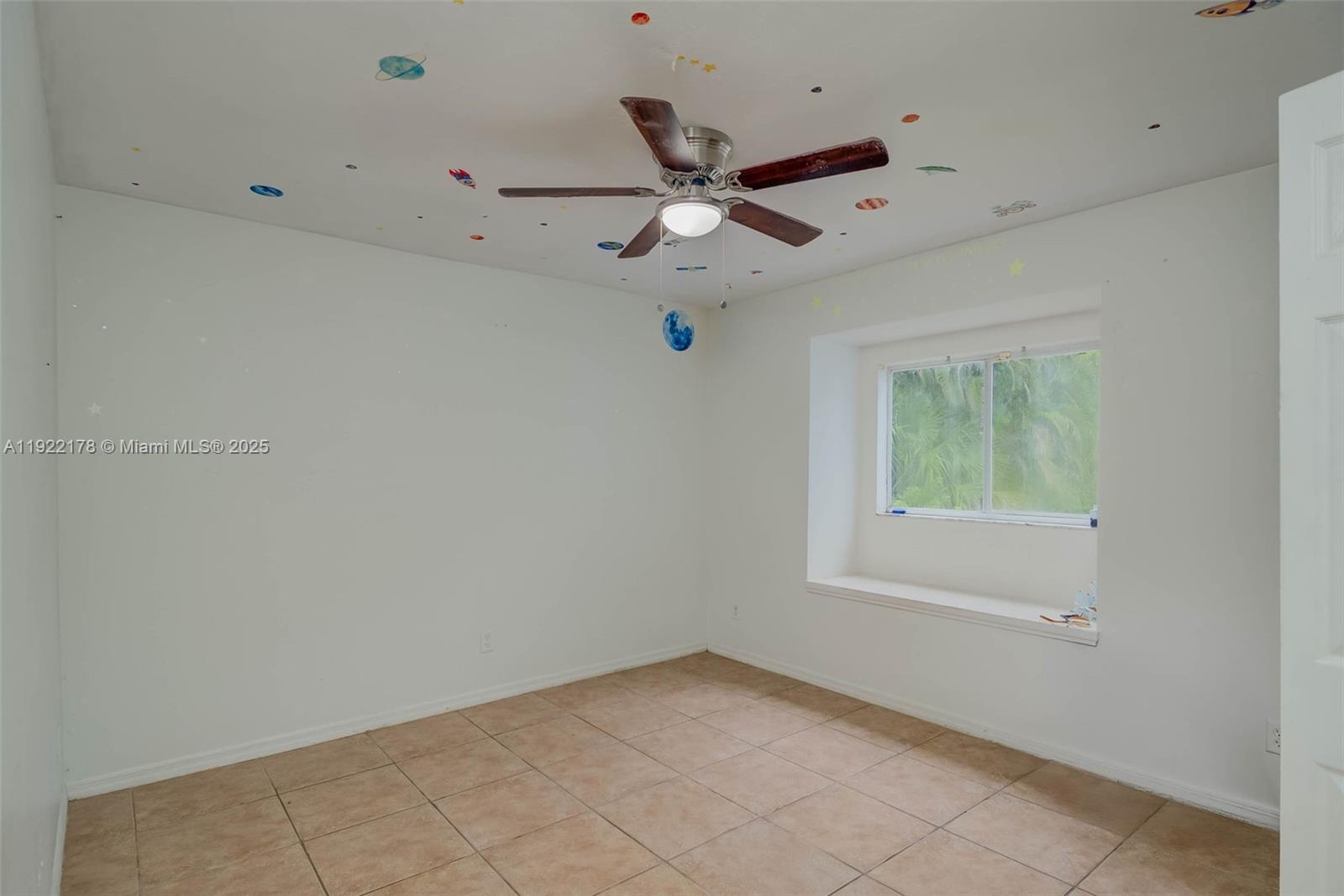 530 7th Street Southwest Naples, FL 34117 - Photo 17 of 32 a view of an empty room with a window