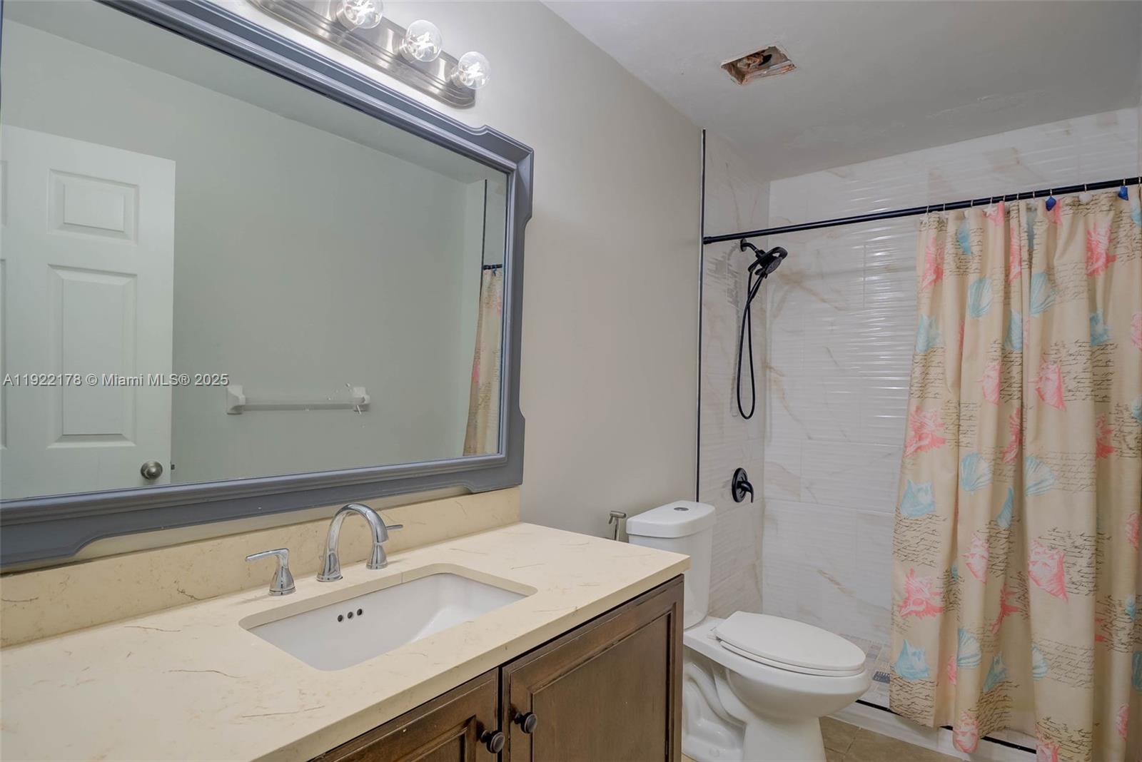 530 7th Street Southwest Naples, FL 34117 - Photo 18 of 32 a bathroom with a sink toilet and shower