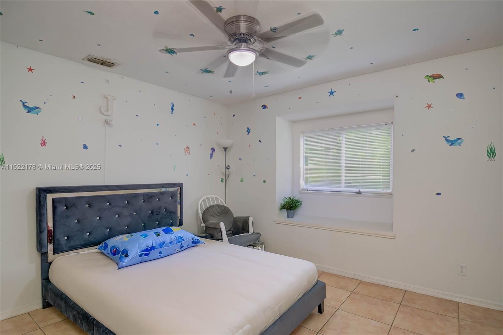530 7th Street Southwest Naples, FL 34117 - Photo 19 of 32 a bedroom with a bed and a table