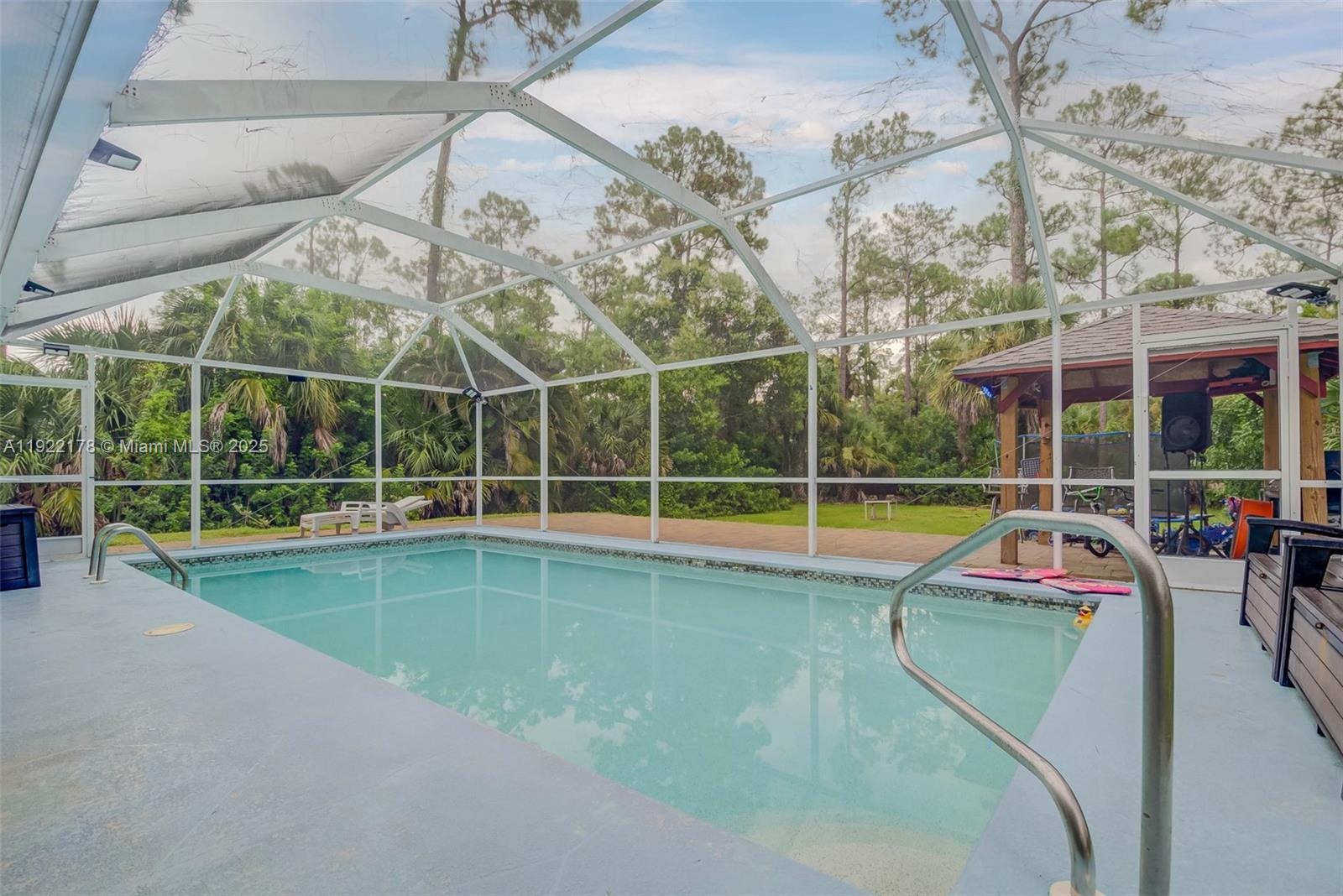 530 7th Street Southwest Naples, FL 34117 - Photo 24 of 32 a view of a house with a swimming pool