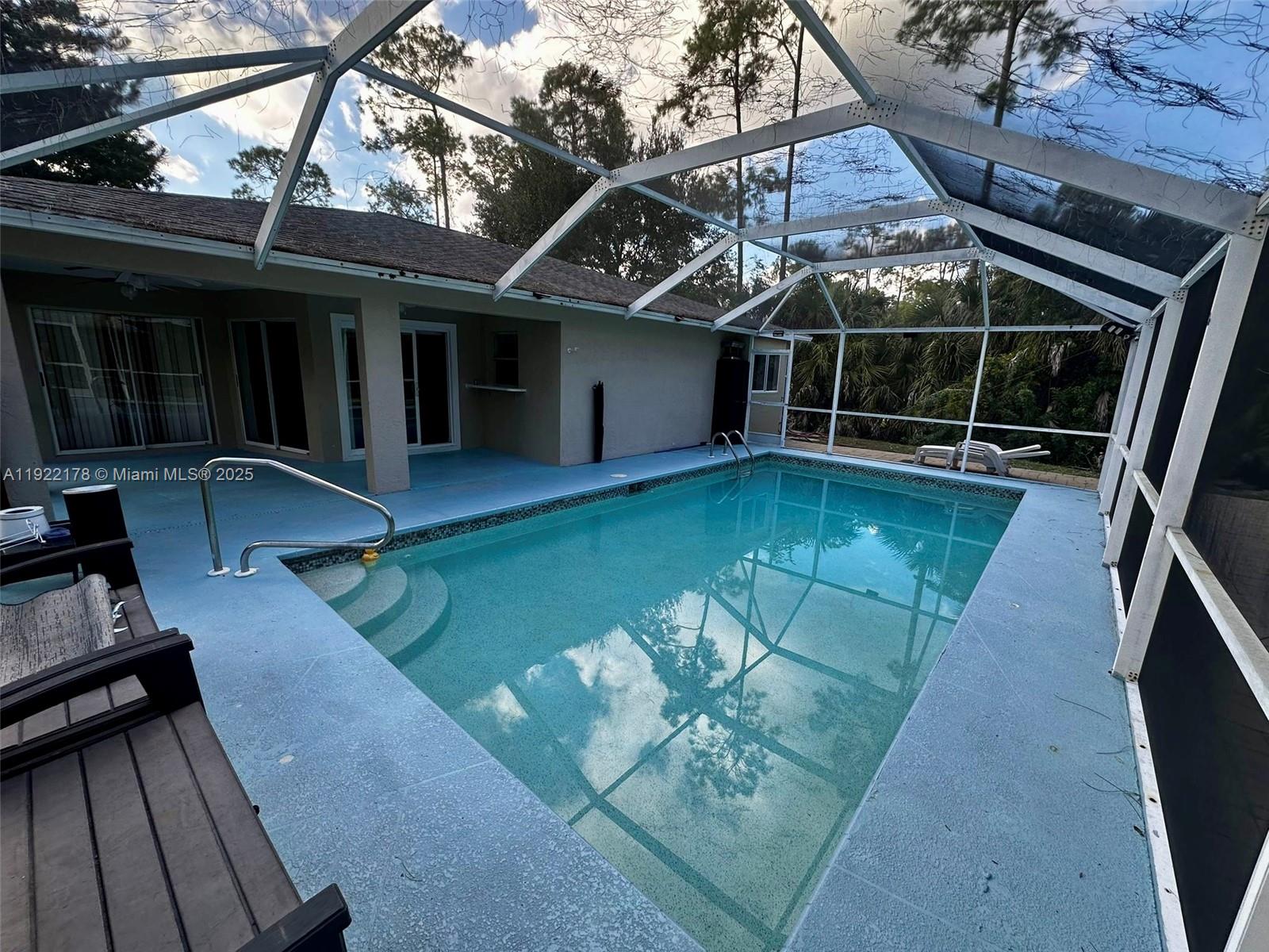 530 7th Street Southwest Naples, FL 34117 - Photo 27 of 32 a view of a house with pool