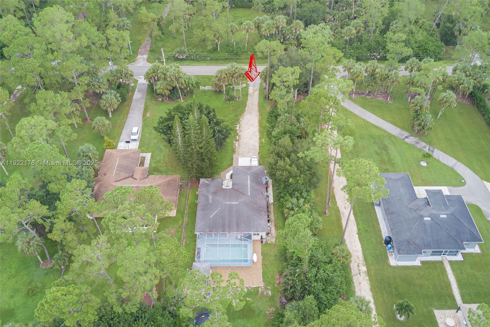 530 7th Street Southwest Naples, FL 34117 - Photo 32 of 32 an aerial view of residential houses with outdoor space and trees