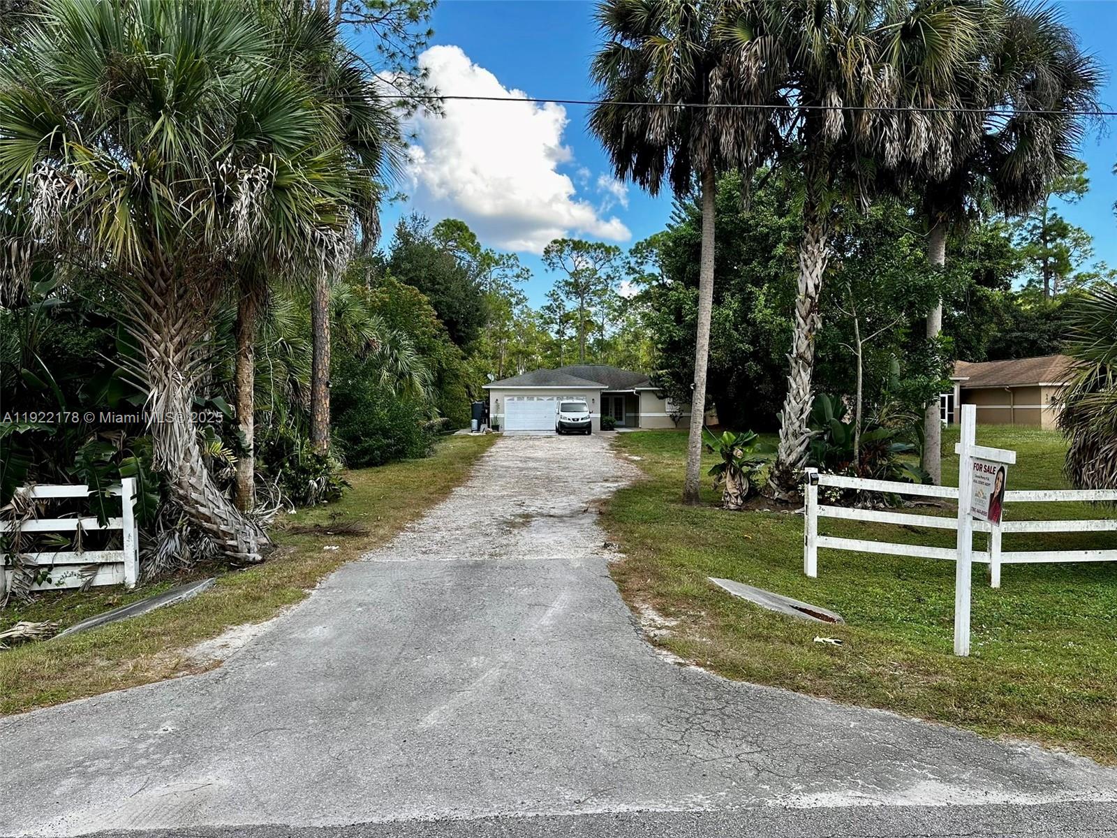530 7th Street Southwest Naples, FL 34117 - Photo 4 of 32 a view of house with outdoor space and sitting area