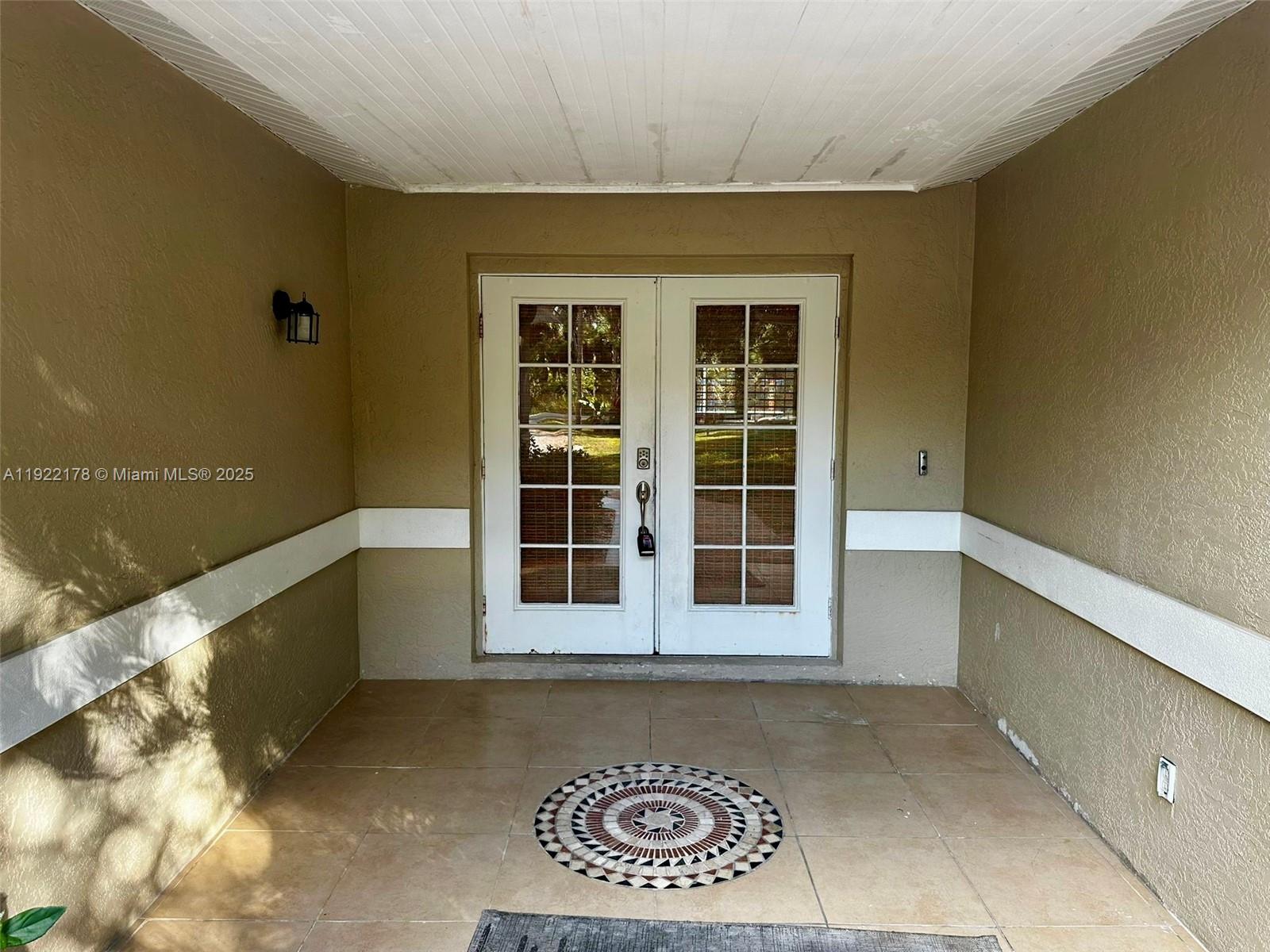 530 7th Street Southwest Naples, FL 34117 - Photo 7 of 32 a view of a house with a large window