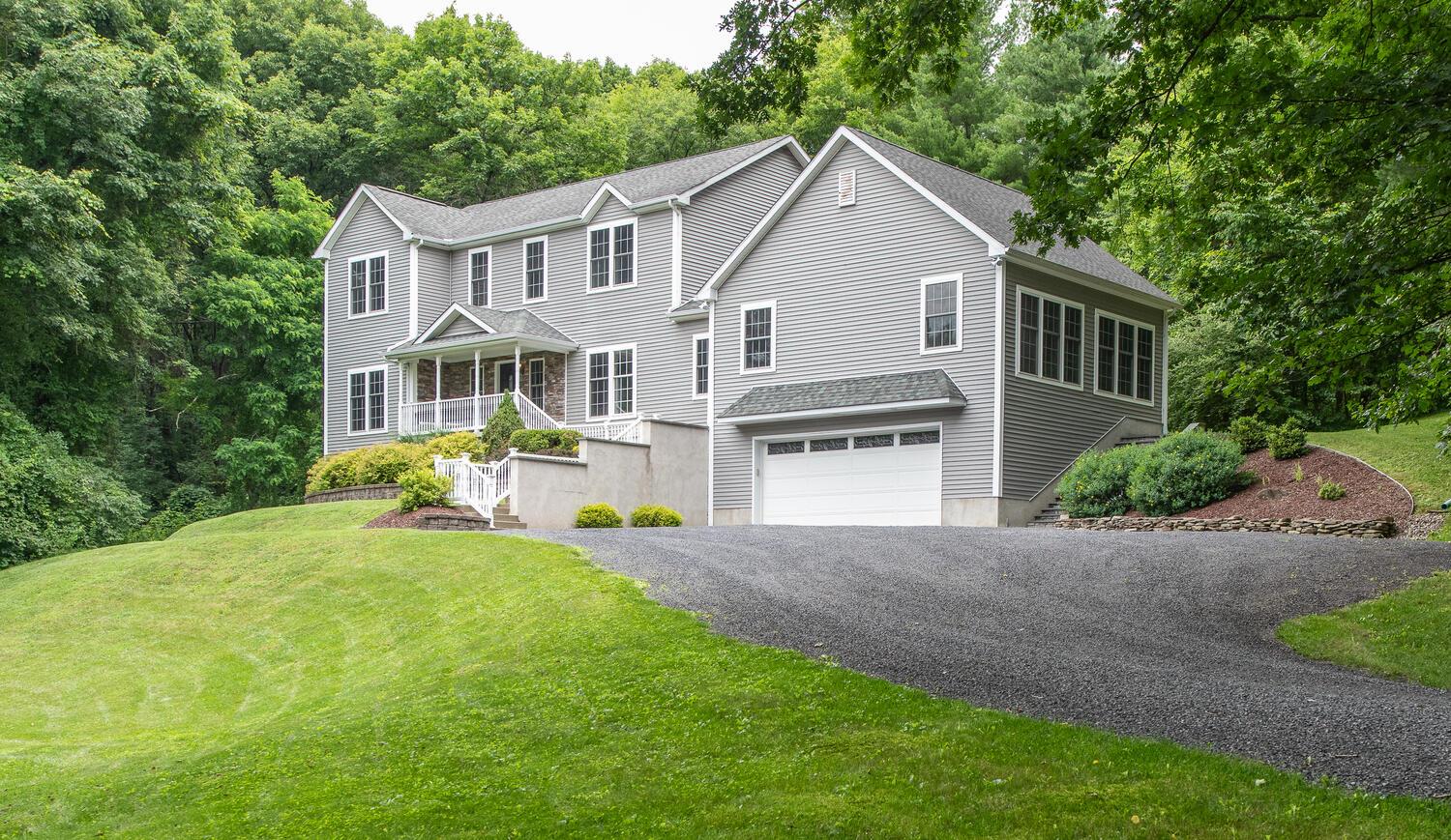117 Deer Run Red Hook, NY 12571 - Photo 1 of 1 a front view of a house with a yard and trees