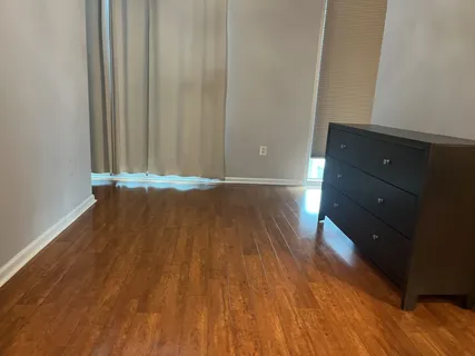 an empty room with wooden floor