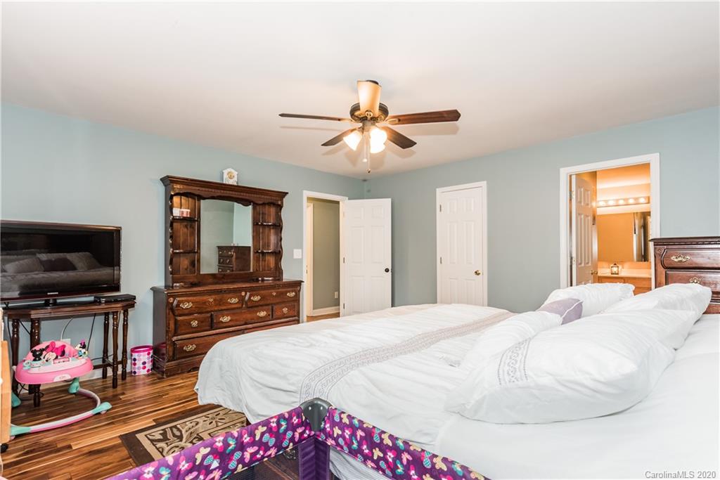 3130 Bush Road Clover, SC 29710 - Photo 14 of 25 a bedroom with a bed and a flat screen tv