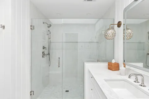 a bathroom with a sink and a shower
