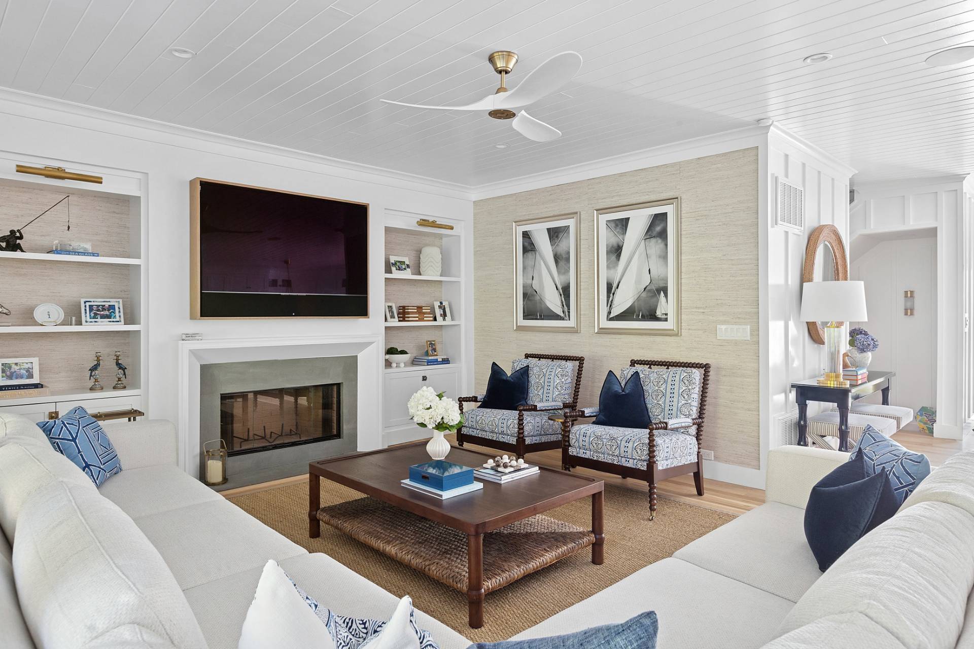 9 Reed Pond Court Water Mill, NY 11976 - Photo 2 of 13 a living room with furniture a fireplace and a flat screen tv