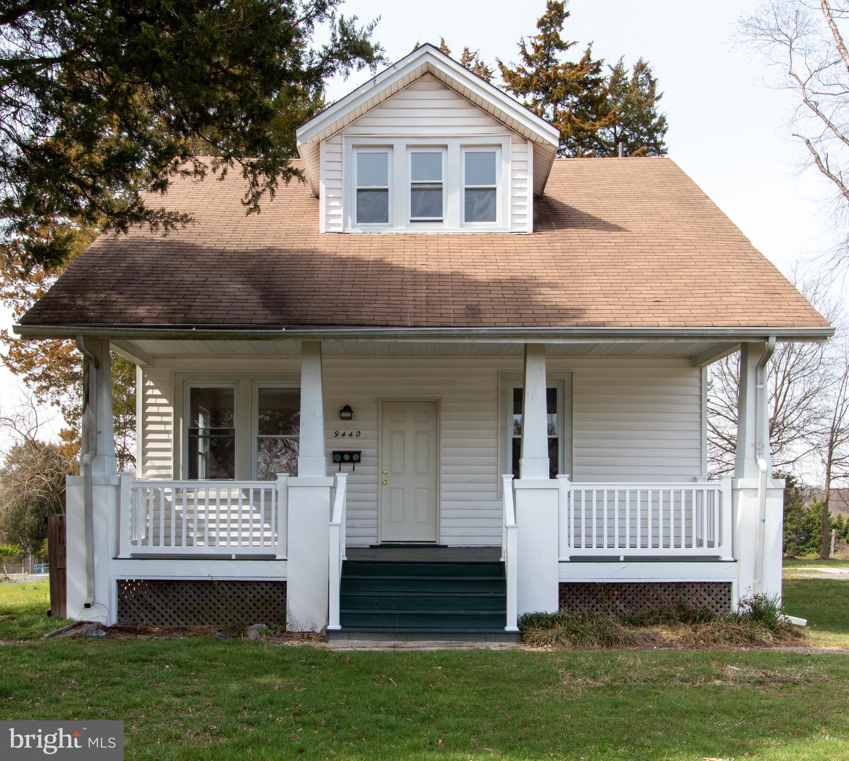 9440 Riggs Road Adelphi, MD 20783 - Photo 1 of 18 a front view of a house with a yard