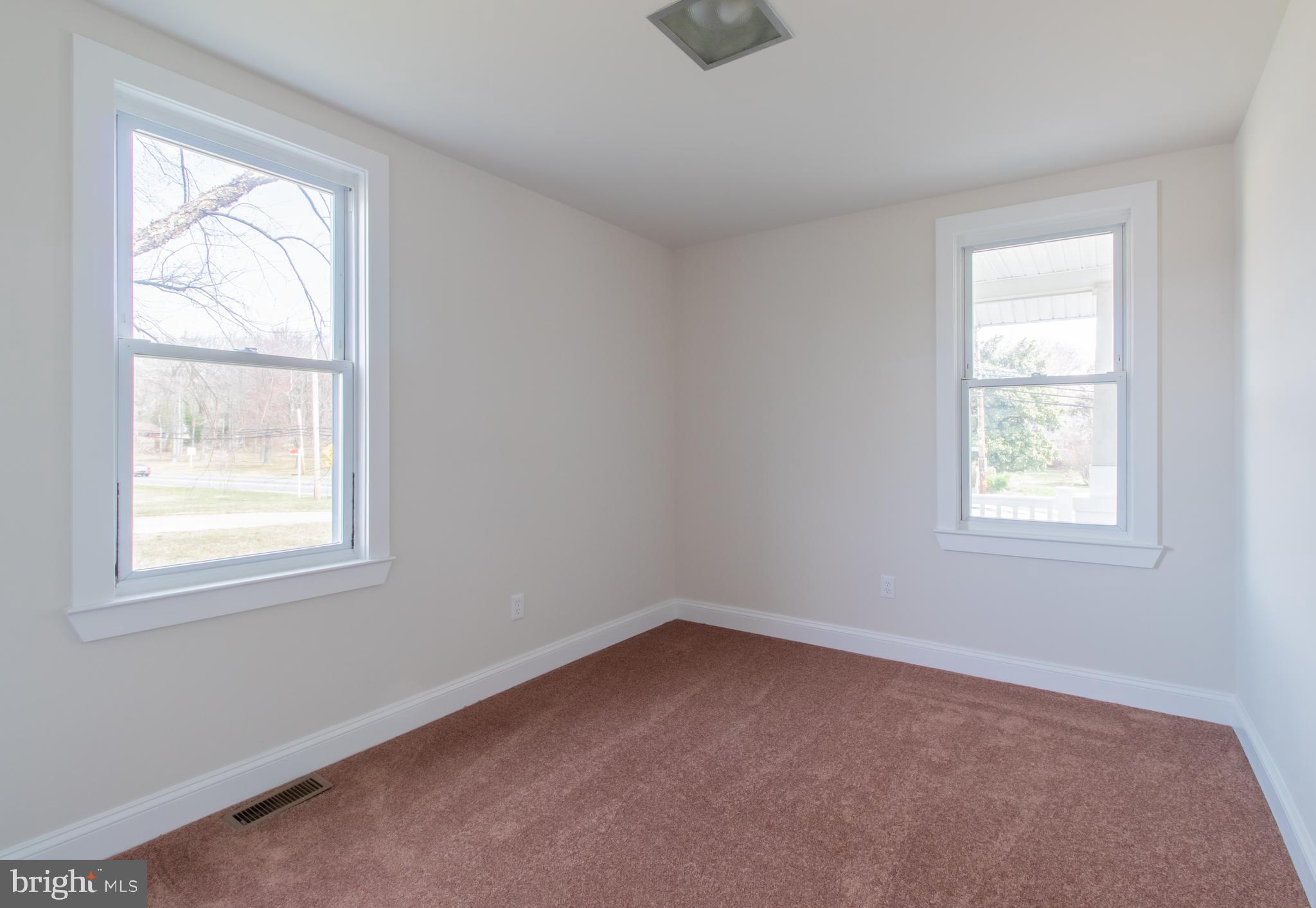 9440 Riggs Road Adelphi, MD 20783 - Photo 12 of 18 an empty room with a window