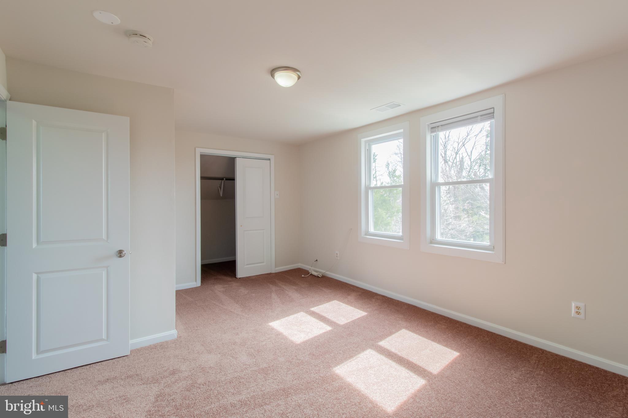 9440 Riggs Road Adelphi, MD 20783 - Photo 18 of 18 a view of an empty room with a window