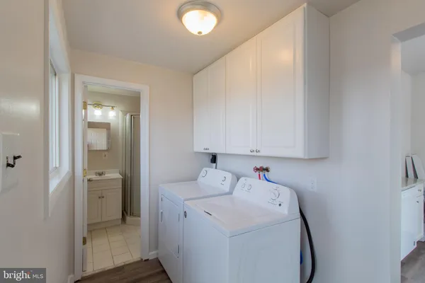 a utility room with dryer and washer