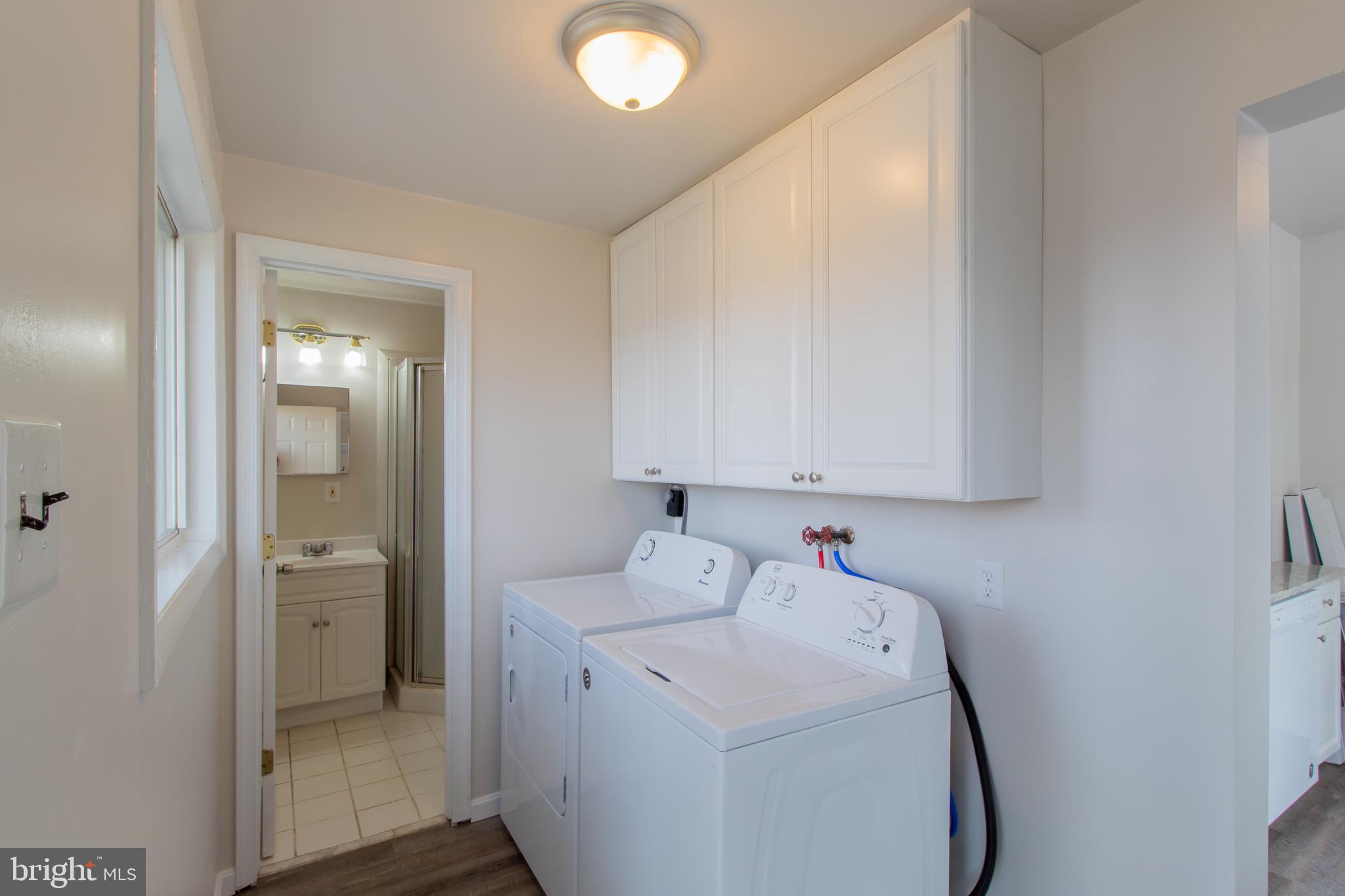 9440 Riggs Road Adelphi, MD 20783 - Photo 4 of 18 a utility room with dryer and washer