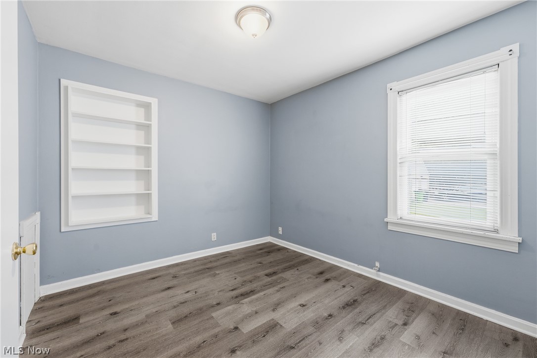 311 Fowles Road Berea, OH 44017 - Photo 17 of 40 Room featuring wood-finish flooring, light blue walls, and white baseboards