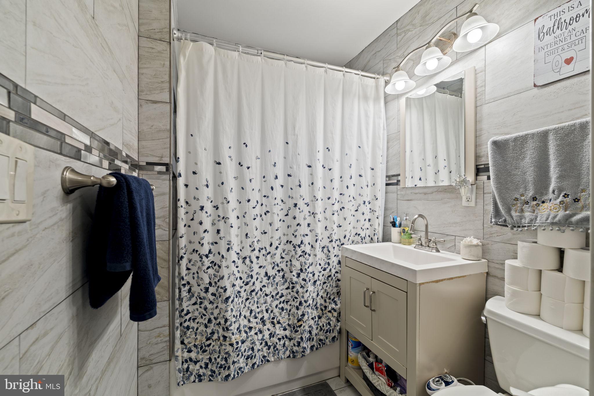 3105 Newportville Road Bristol, PA 19007 - Photo 11 of 30 a bathroom with a sink toilet and shower