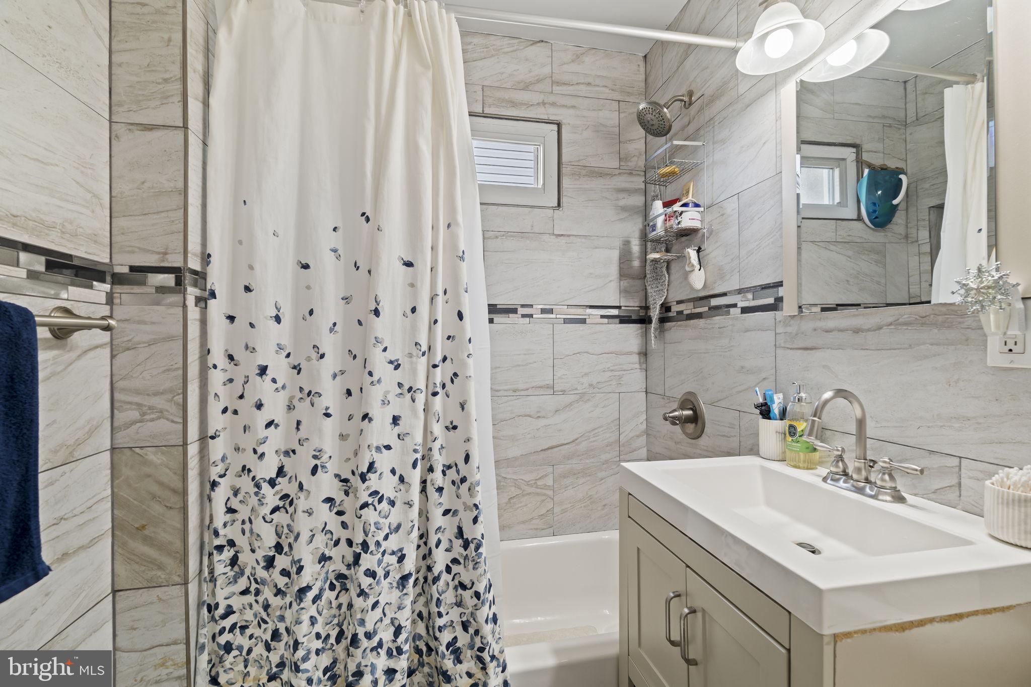 3105 Newportville Road Bristol, PA 19007 - Photo 12 of 30 a bathroom with a sink toilet and shower