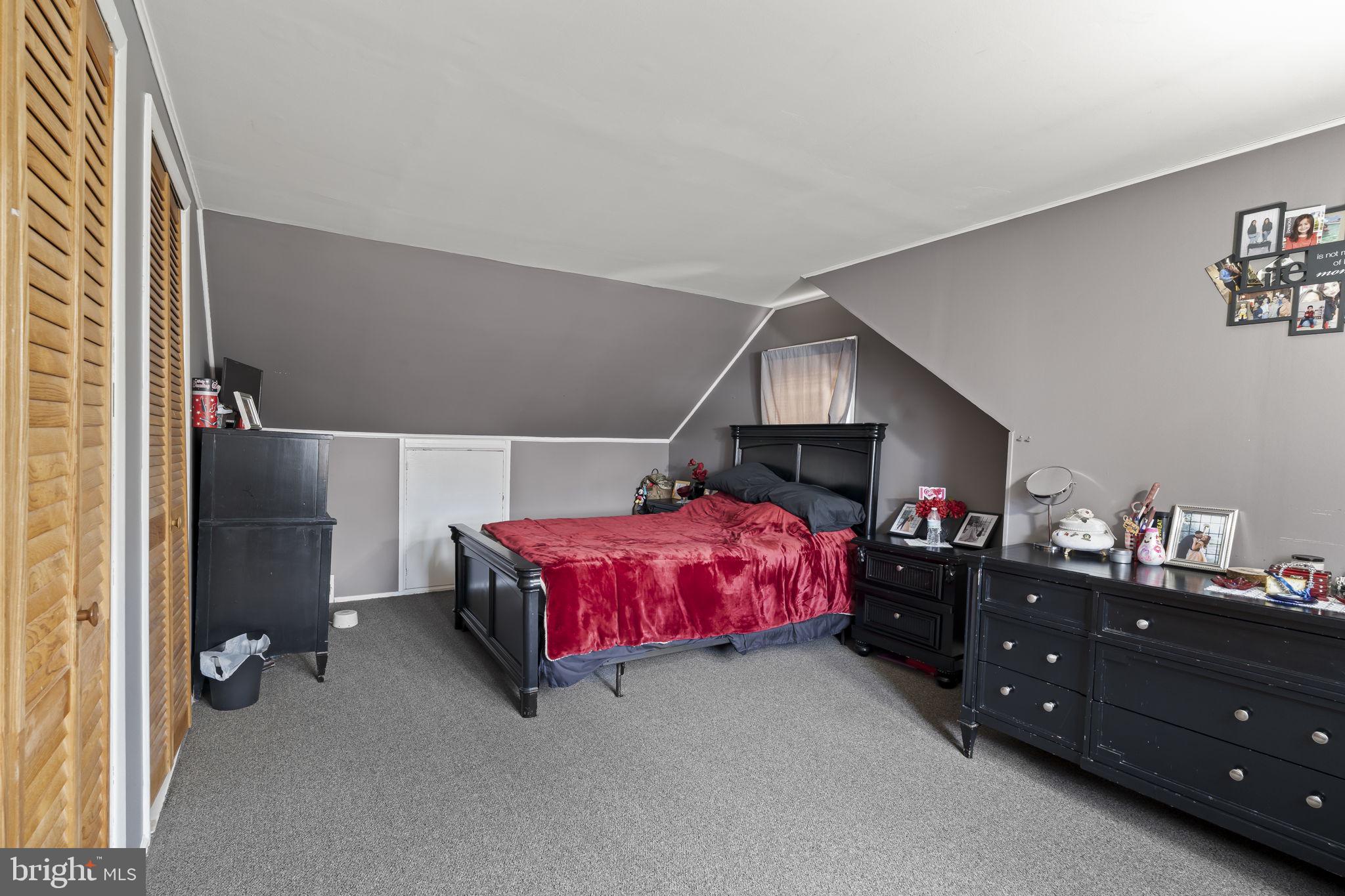 3105 Newportville Road Bristol, PA 19007 - Photo 16 of 30 a bedroom with a bed and a dresser