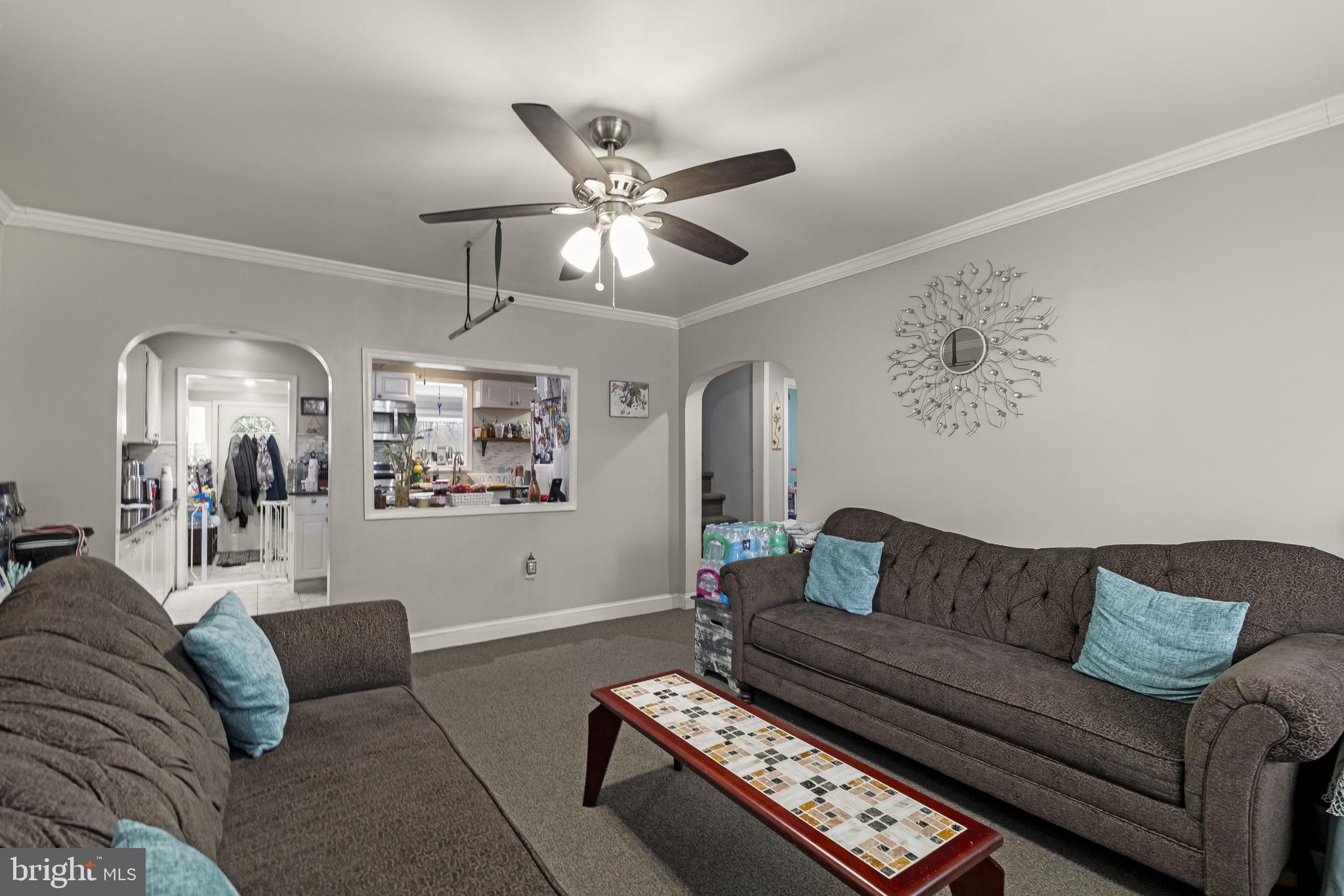 3105 Newportville Road Bristol, PA 19007 - Photo 2 of 30 a living room with furniture and a chandelier