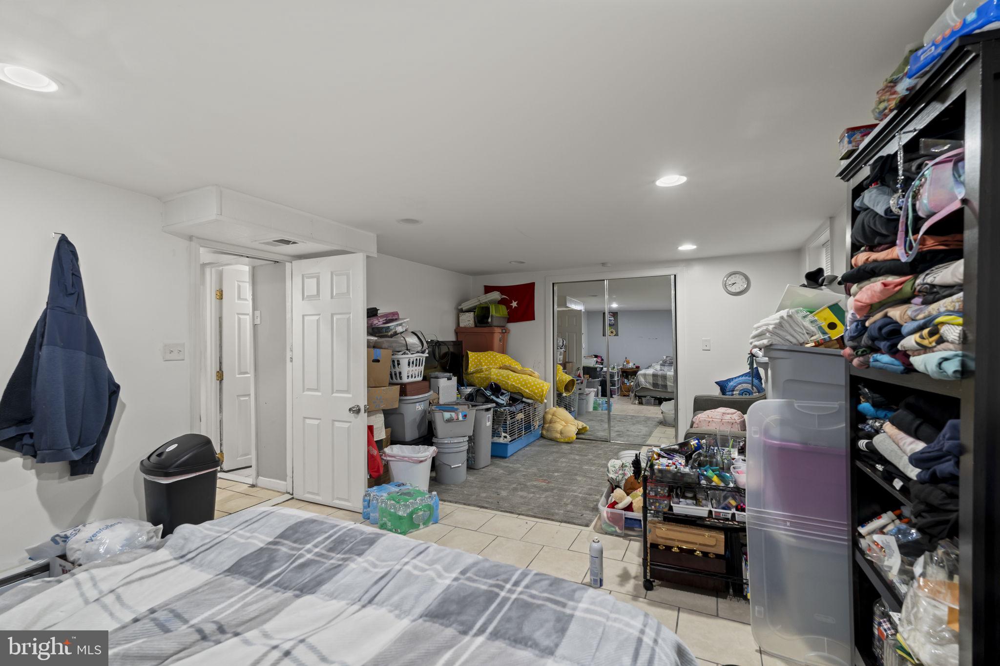 3105 Newportville Road Bristol, PA 19007 - Photo 22 of 30 a living room with lots of furniture and a flat screen tv