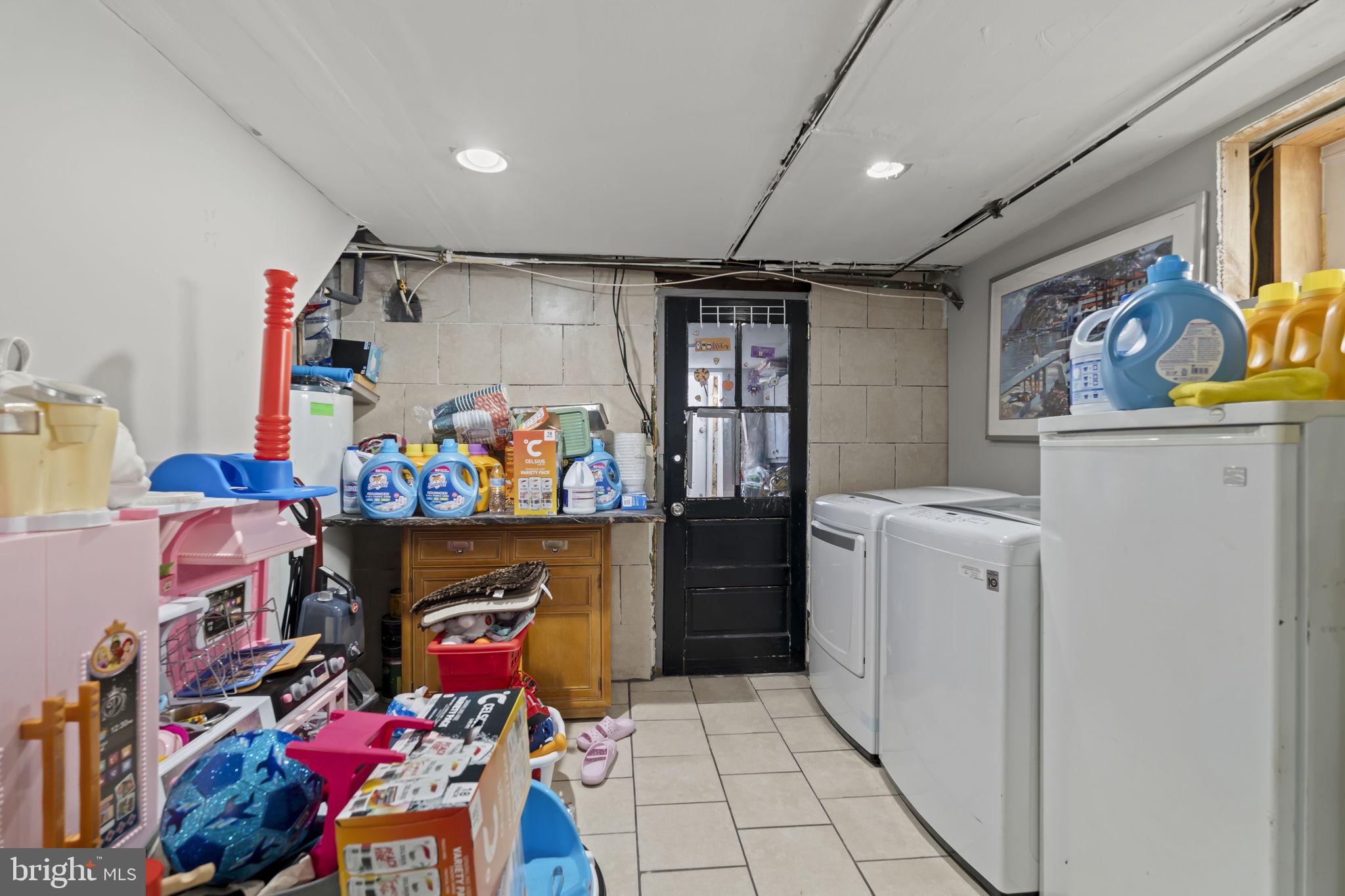 3105 Newportville Road Bristol, PA 19007 - Photo 25 of 30 a storage room with washer and dryer