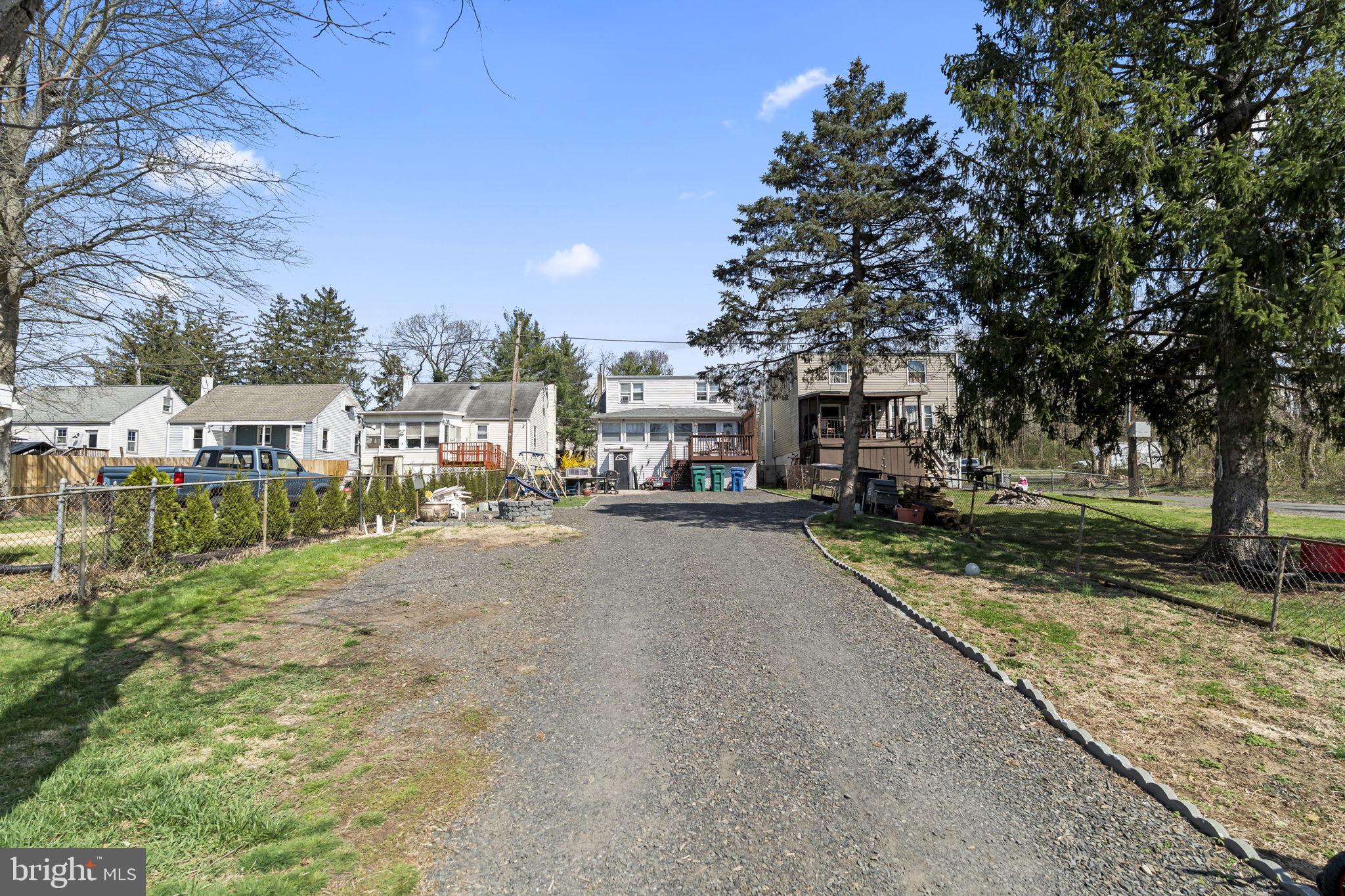 3105 Newportville Road Bristol, PA 19007 - Photo 26 of 30 a view of a street with a large trees