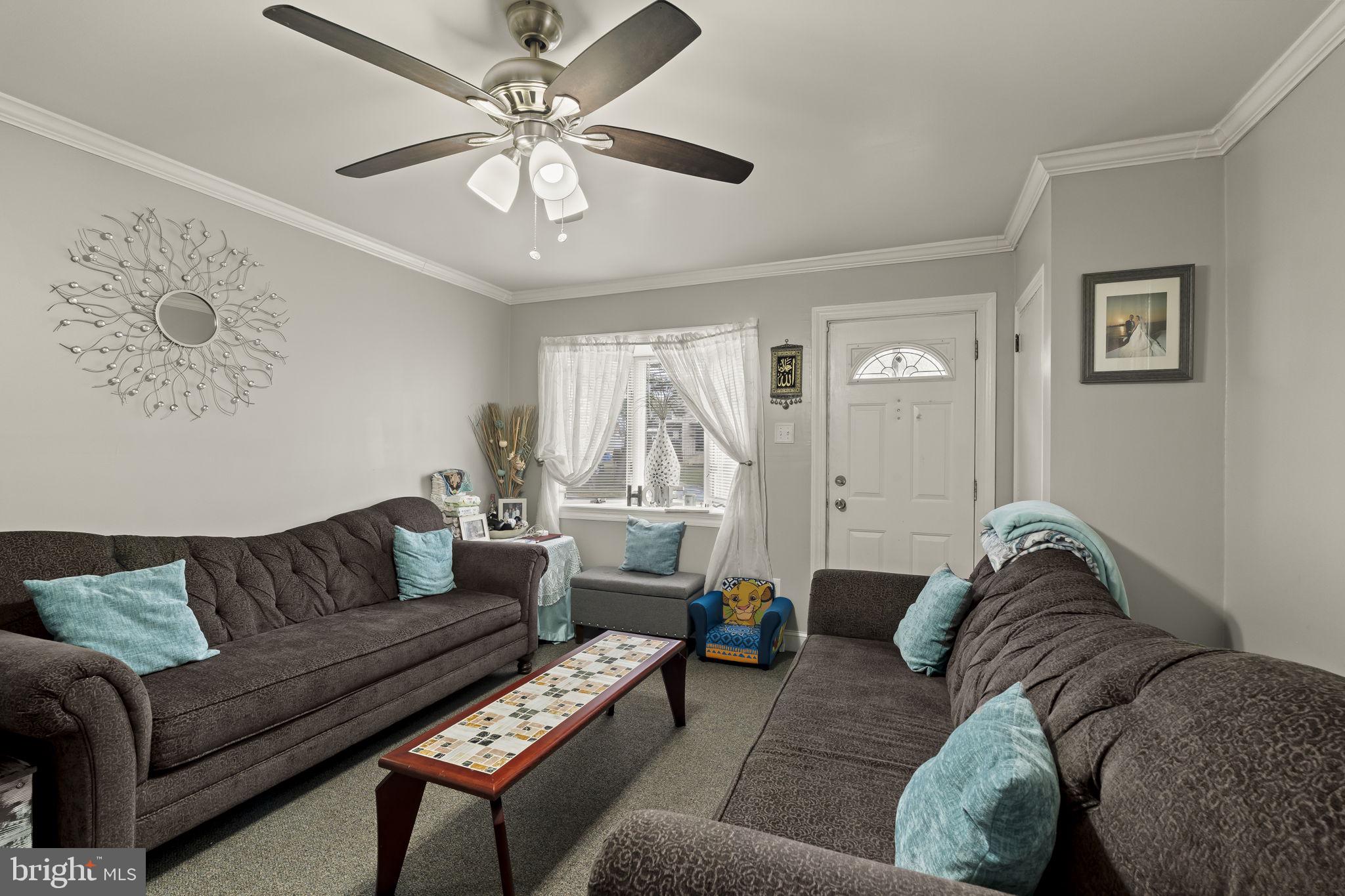 3105 Newportville Road Bristol, PA 19007 - Photo 3 of 30 a living room with furniture and a chandelier