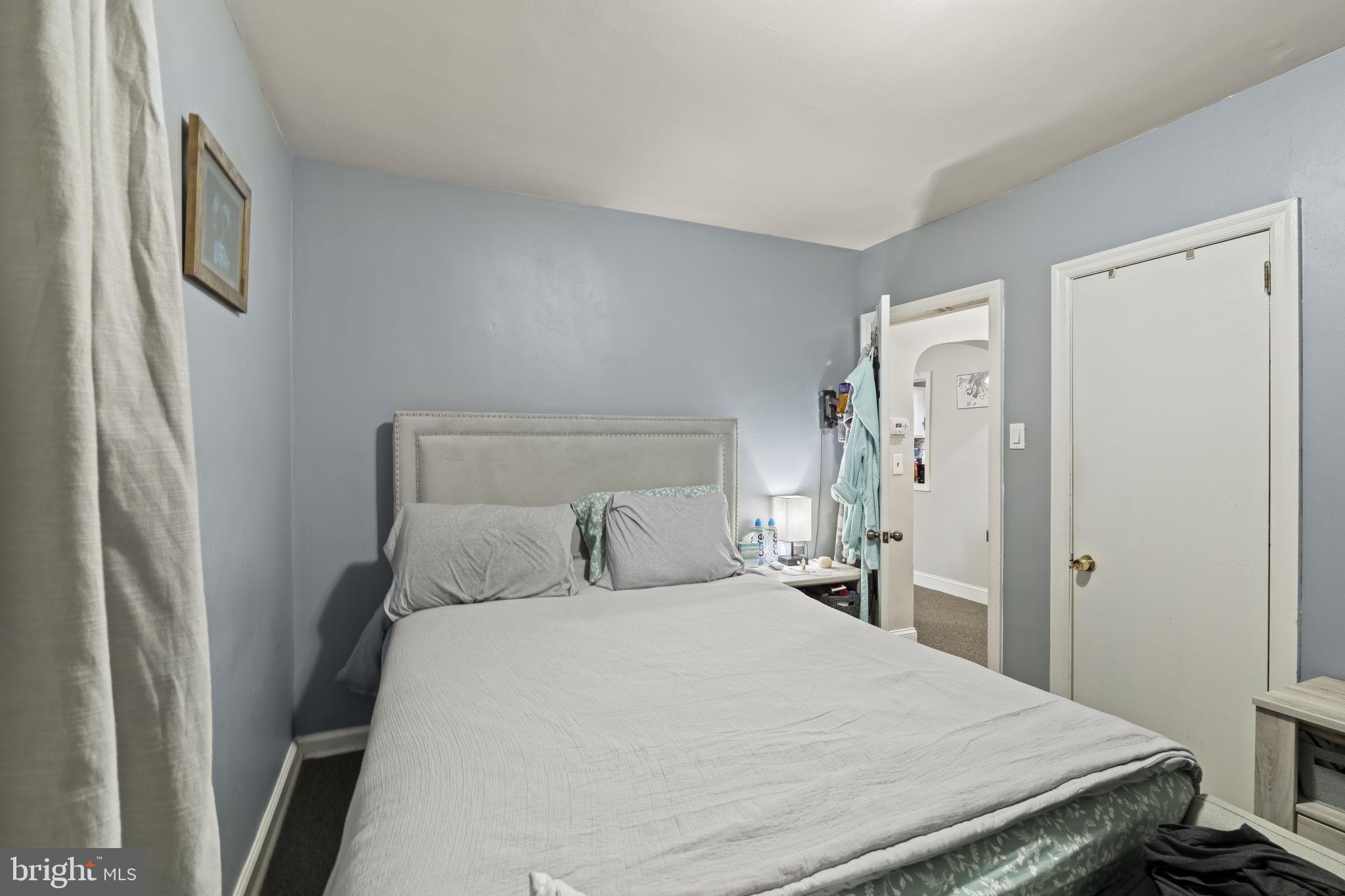 3105 Newportville Road Bristol, PA 19007 - Photo 9 of 30 a bedroom with a bed and wooden floor