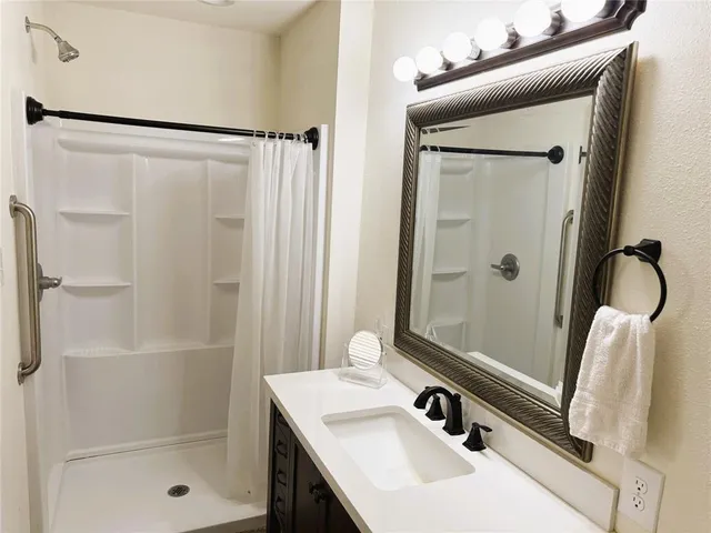 a kitchen with stainless steel appliances granite countertop a stove a sink dishwasher and a refrigerator