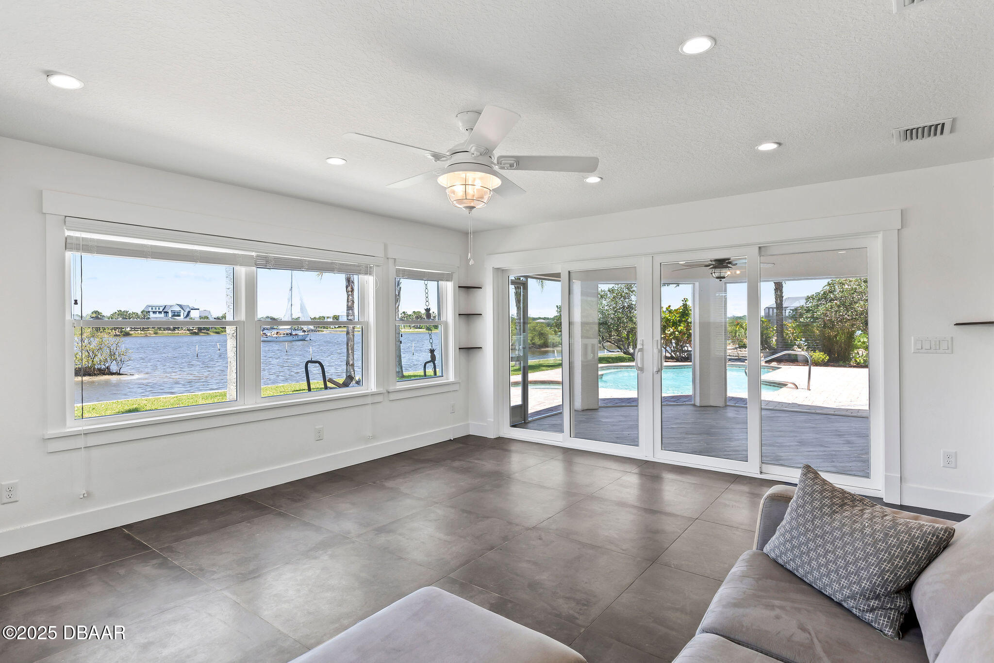 604 Springdale Drive Flagler Beach, FL 32136 - Photo 22 of 78 a view of an empty room with wooden floor and a window